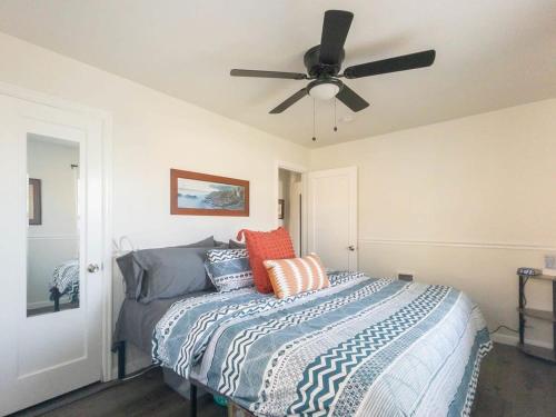 a bedroom with a bed with a ceiling fan at #StayInMyDistrict Walla Walla Wine Getaway in Walla Walla