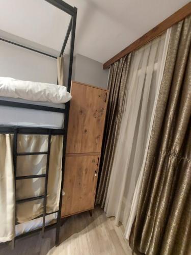 a bedroom with a bunk bed and a window at Moon Hostel in Istanbul