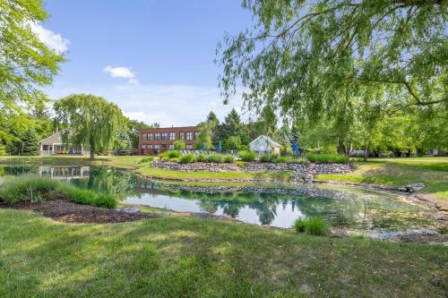 a pond in front of a building at Schoolhouse Rock in New Buffalo