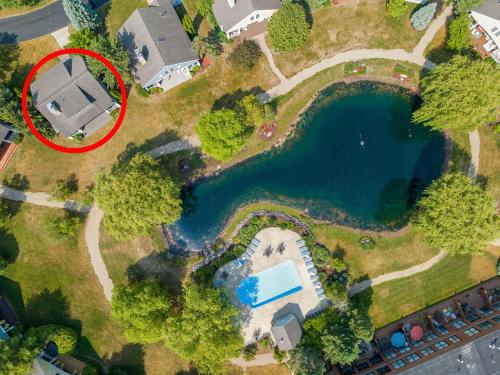 an aerial view of a house next to a lake at Schoolhouse Rock in New Buffalo