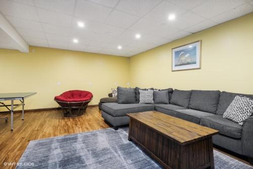 a living room with a couch and a table at Scout's Haven in Rolling Prairie