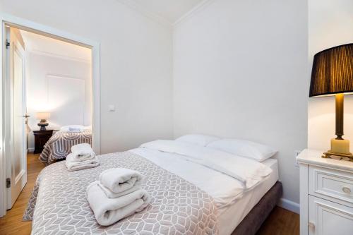 Ένα ή περισσότερα κρεβάτια σε δωμάτιο στο Apartamenty Magia