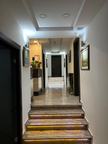 a hallway with stairs leading to a door at Atrium in Sremska Mitrovica