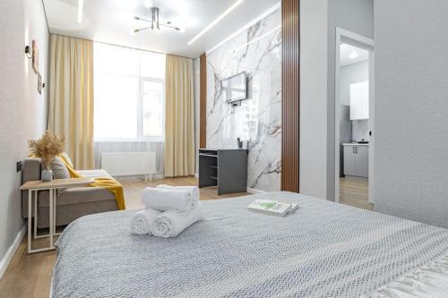 Ένα ή περισσότερα κρεβάτια σε δωμάτιο στο Apartment near Astana Arena, EXPO 2017