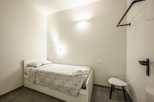 Postel nebo postele na pokoji v ubytování College Suites