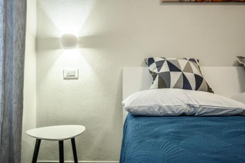 Postel nebo postele na pokoji v ubytování College Suites
