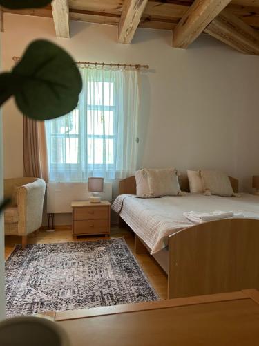 Una cama o camas en una habitación de In heart of Trakai you'll find authentic Karaim house