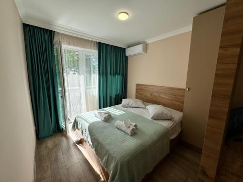 Postel nebo postele na pokoji v ubytování Green House in Tskaltubo
