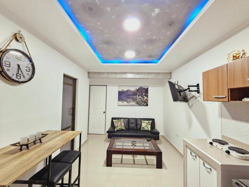 a living room with a couch and a table at Departamento Familiar Privado in Antofagasta