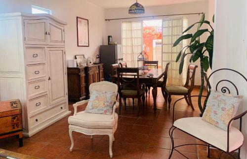 a dining room with a table and chairs at Villa Coyoacan in Mexico City