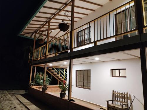 a building with a staircase on the side of it at San Jose Coffee farm in Calarcá