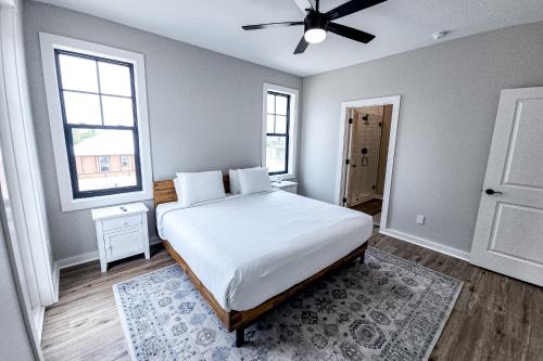 a bedroom with a bed and a ceiling fan at Gin Fizz in Port Saint Joe