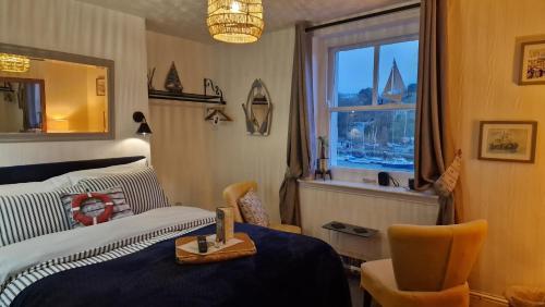 a bedroom with a bed and a window at The Ocean Guest House in Weymouth