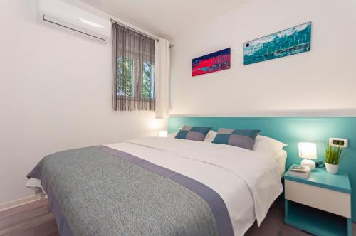 a bedroom with a large bed and a window at Apartment Feel the nature in Slime