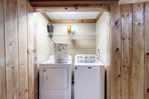 a small kitchen with a stove and a refrigerator at Morganton Escape in Morganton