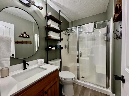 a bathroom with a shower and a sink and a toilet at Beehive Basecamp Explore Ski Play and Make Memories in Parowan