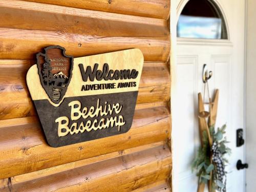 a sign on the side of a wooden building at Beehive Basecamp Explore Ski Play and Make Memories in Parowan
