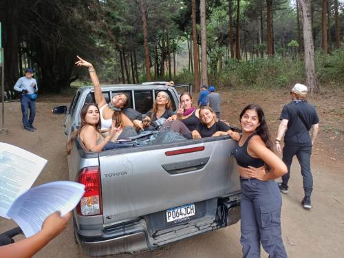 a group of people in the back of a truck at Blue Moon Hostel in Antigua Guatemala