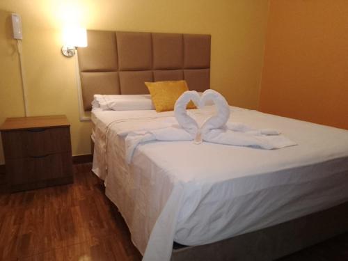 Letto o letti in una camera di HOTEL BRILLO