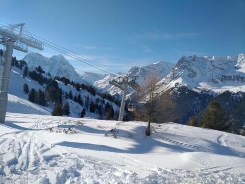 a snow covered mountain with a ski lift at Chalet Walser à VALLORCINE 13 kms CHAMONIX France in Vallorcine