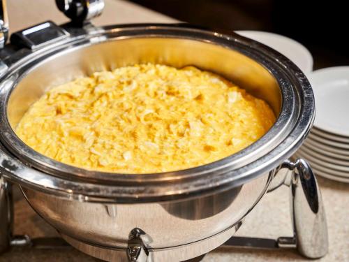 a casserole dish of food in a pot at Daiwa Roynet Hotel Wakayama in Wakayama