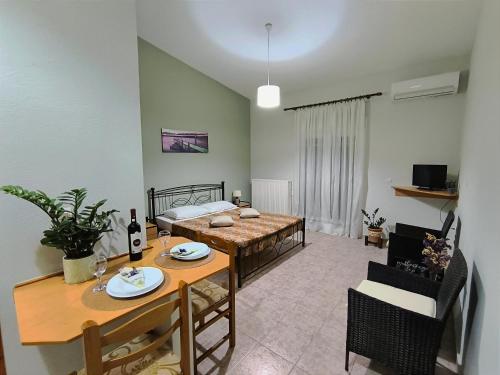 a living room with a table and a dining room at My Lemnos Studios - Studio 4 in Repanídhion