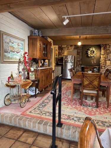 a kitchen and dining room with a table and a dining room gmaxwell gmaxwell at Carmel Valley Lodge in Carmel Valley