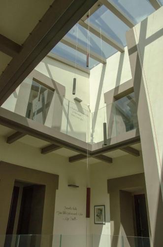a glass ceiling in a building with a window at Antico Sipario Boutique Hotel, BW Signature Collection in Paciano