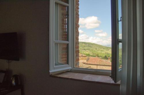 a window in a room with a view at Antico Sipario Boutique Hotel, BW Signature Collection in Paciano