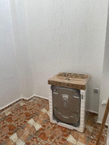 a small television sitting in the corner of a room at Rhach alhoceima in Al Hoceïma