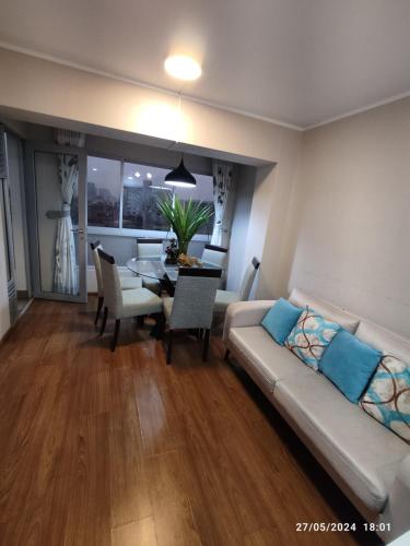 Posezení v ubytování douha mi departamento de 3 habitaciones