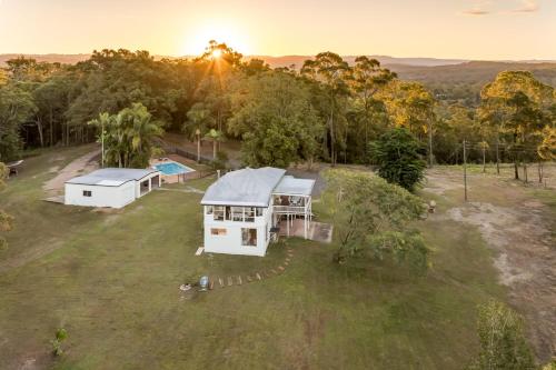an overhead view of a house on a grass field at Lakeview Cottage in Mooloolah Valley in Mooloolah