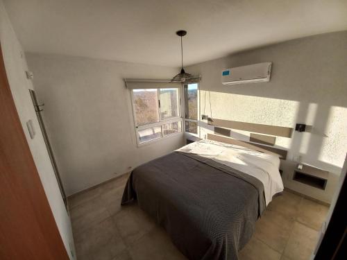 Ένα ή περισσότερα κρεβάτια σε δωμάτιο στο Luces Casas de Montaña