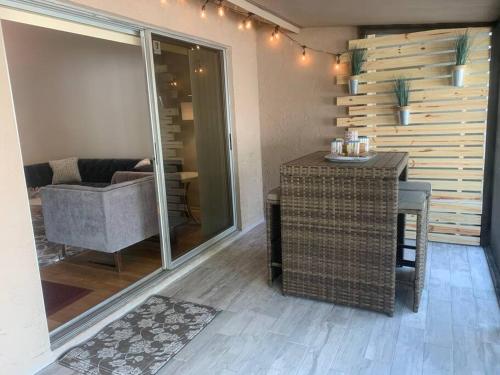 a living room with a table and a couch at Sand Dollar 755 in Sarasota