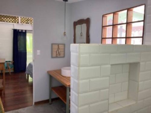a bathroom with a counter and a sink in a room at Punta Uva Puerto Viejo Beach Front House in Punta Uva