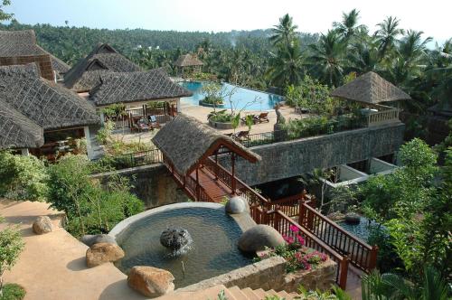 an aerial view of a resort with a swimming pool at Taj Green Cove Resort and Spa Kovalam in Kovalam