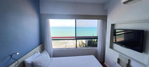 Μια τηλεόραση ή/και κέντρο ψυχαγωγίας στο Flat Brisa - Hotel Mercure Navegantes