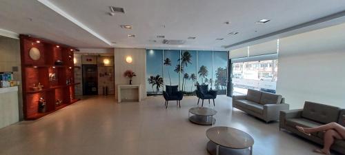 Χώρος καθιστικού στο Flat Brisa - Hotel Mercure Navegantes