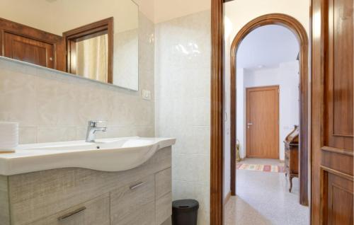 a bathroom with a sink and a mirror at Amazing Apartment In Recco With Kitchen in Recco