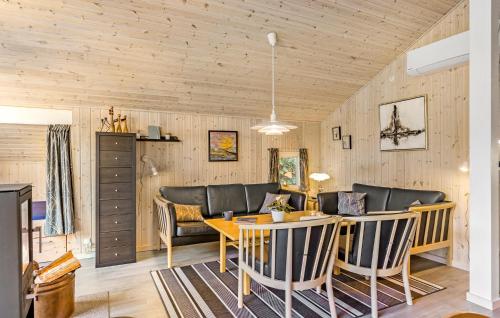 a dining room with a table and chairs at Stunning Home In Tranekær With Sauna in Tranekær