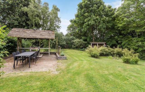 a picnic table and a gazebo in a garden at Gorgeous Home In Højslev With Wifi in Højslev