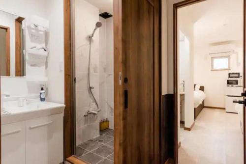 a bathroom with a shower and a sink at 2, Nerima, 1st floor apartment, 練馬 in Tokyo