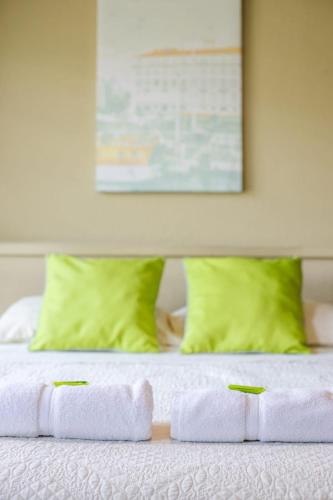 a close up of a bed with towels on it at Hotel y Cabinas del Trópico in Guápiles
