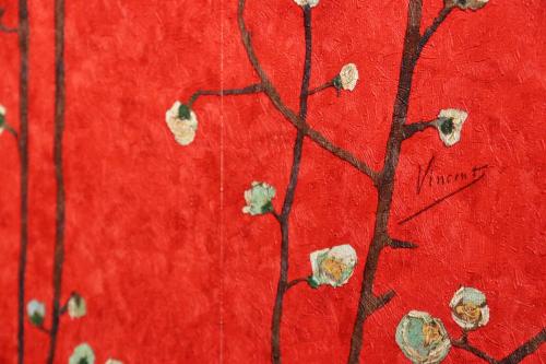a painting of a red wall with flowers on it at 料理旅館ゆり野 in Wajiki