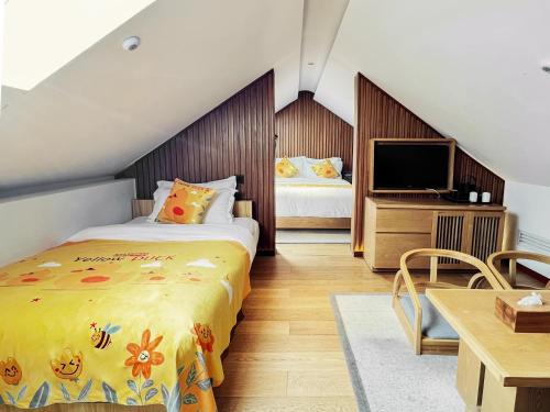 Cama o camas de una habitación en 北京悦明元星空白塔景观四合院民宿