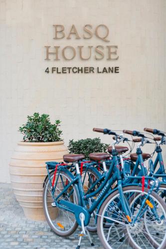 a group of bikes parked in front of a bisco house at Basq House in Byron Bay