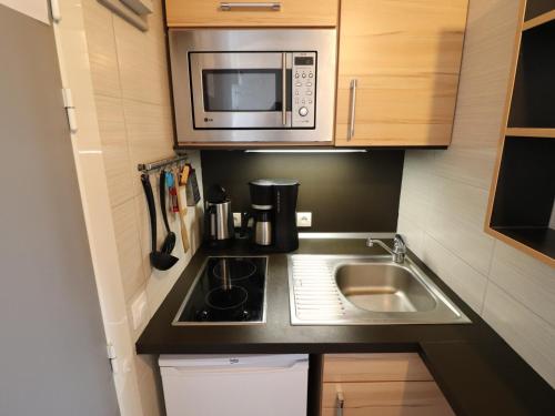 Photo de la galerie de l'établissement Studio à Tignes Le Lac · Rénové · Pied des pistes et commerces - FR-1-502-560, à Tignes