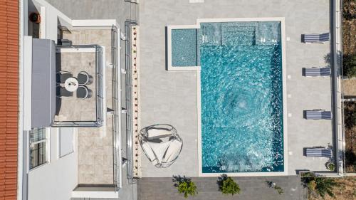 an aerial view of a swimming pool on a house at Family harmony in Plano