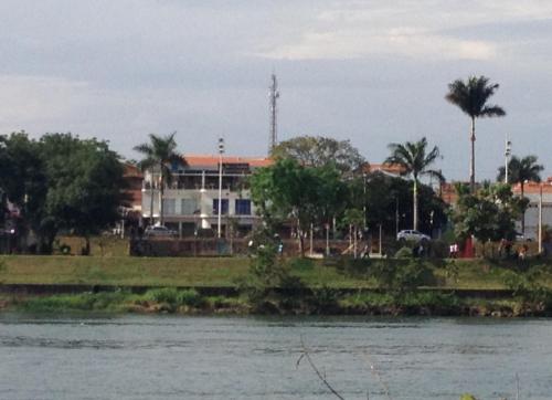 a building on the side of a river at Pousada Beira Rio in Itumbiara