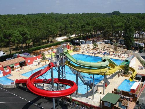 an aerial view of a water park with a water slide at Mobil home La palmyre 8 Pers in Les Mathes